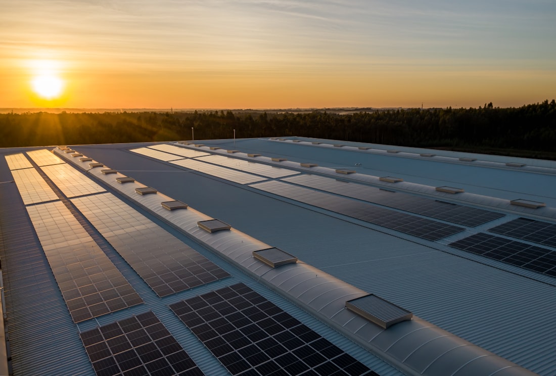 Technician installing solar panels on a rooftop